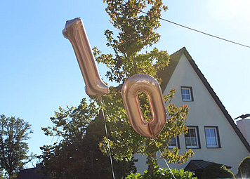 Rose Goldene Luftballons in Zahlenform einer 10
